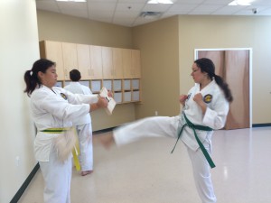 Mariya breaks a board held by Wendy. 